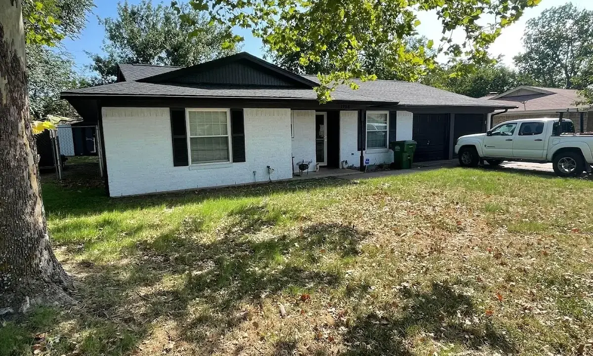 Professional roofing crew working on a residential roof in Hendersonville